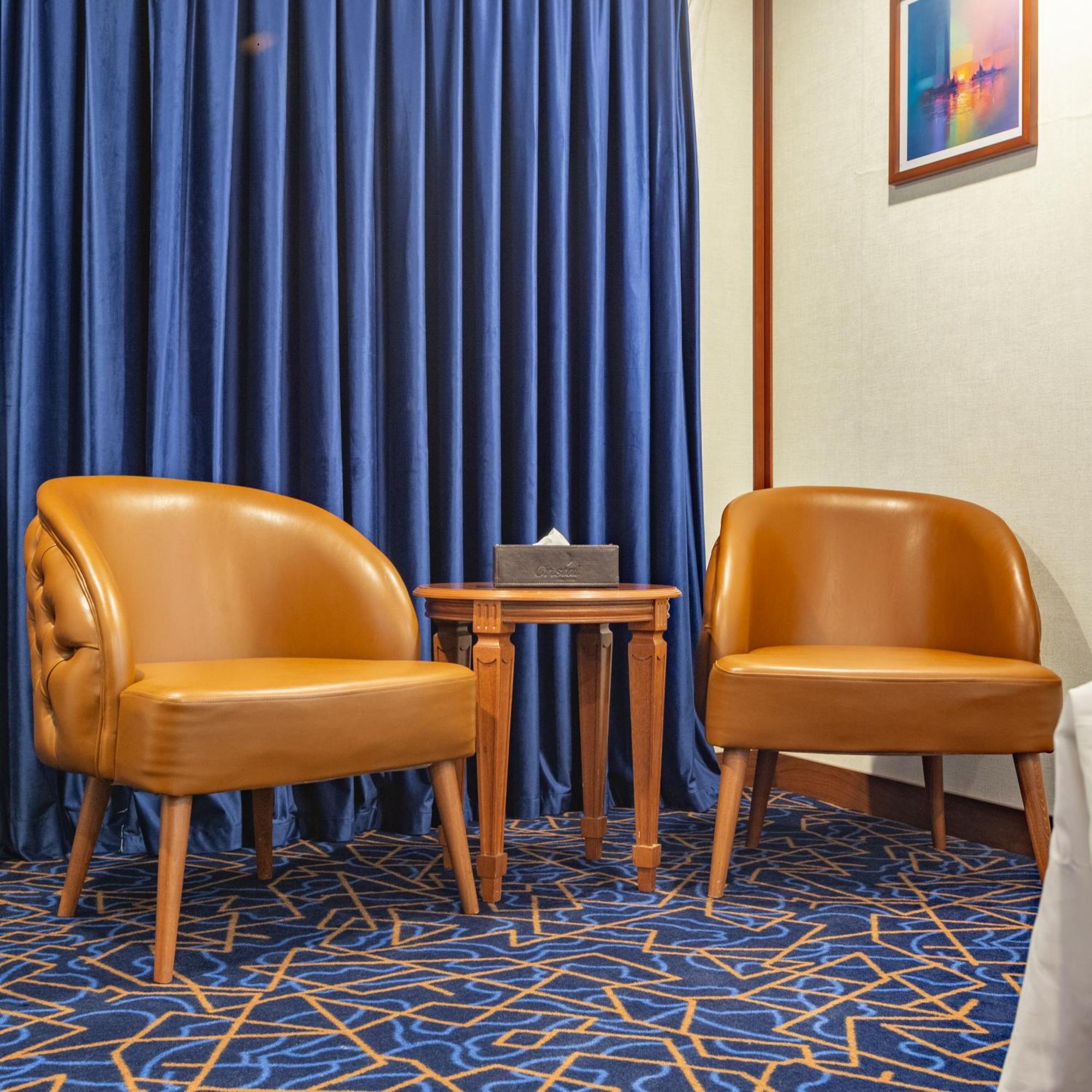 Cristal Erbil Hotel Exterior photo A pair of club chairs